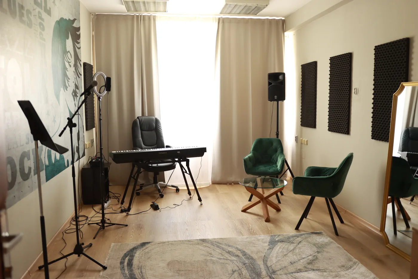Second Singasong studio with green armchairs