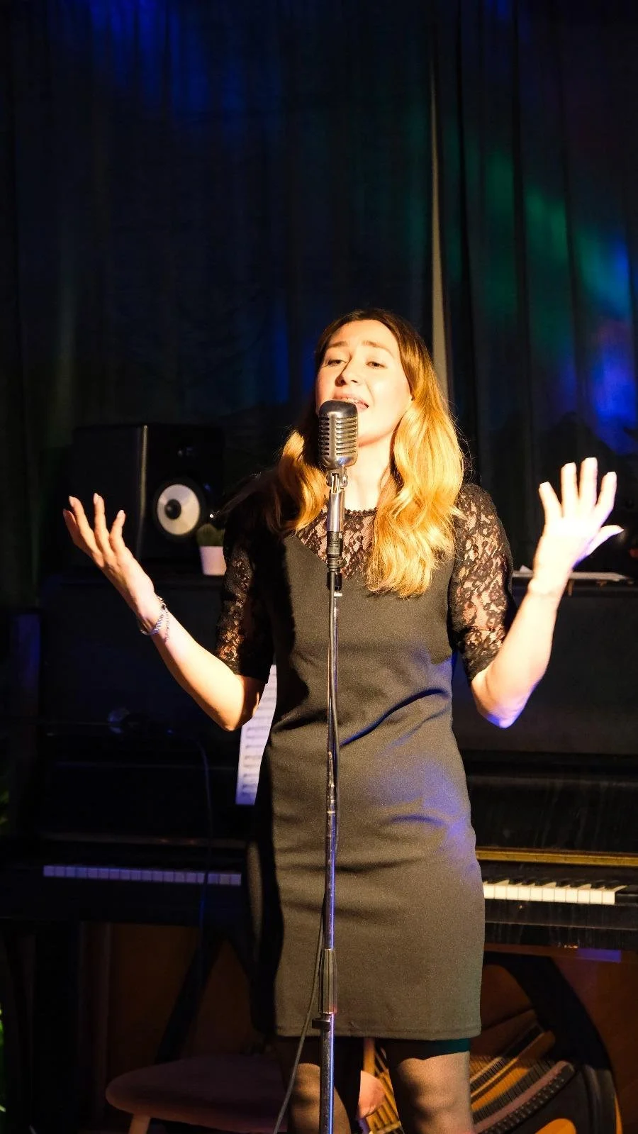 Singasong student singing into a microphone