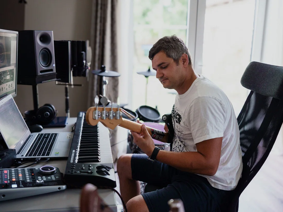Alex Rezzo creating music in the studio